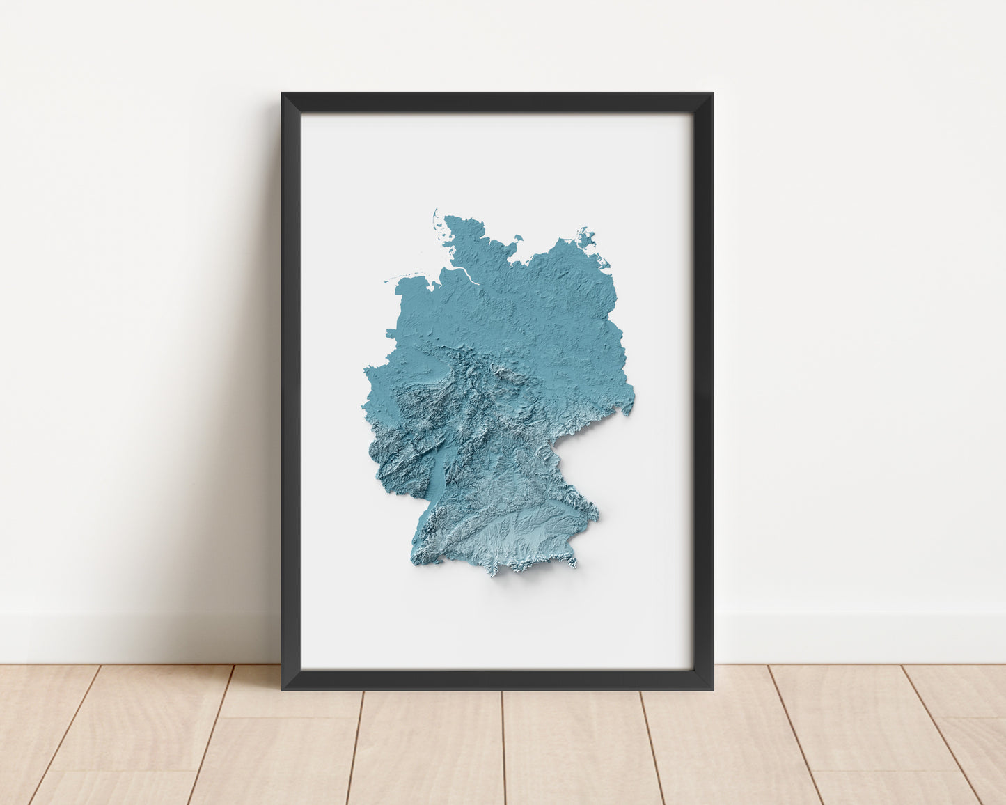 A minimalist relief map of Germany in a frame made out of pine wood. Topographic map poster for travel and geography fans.
