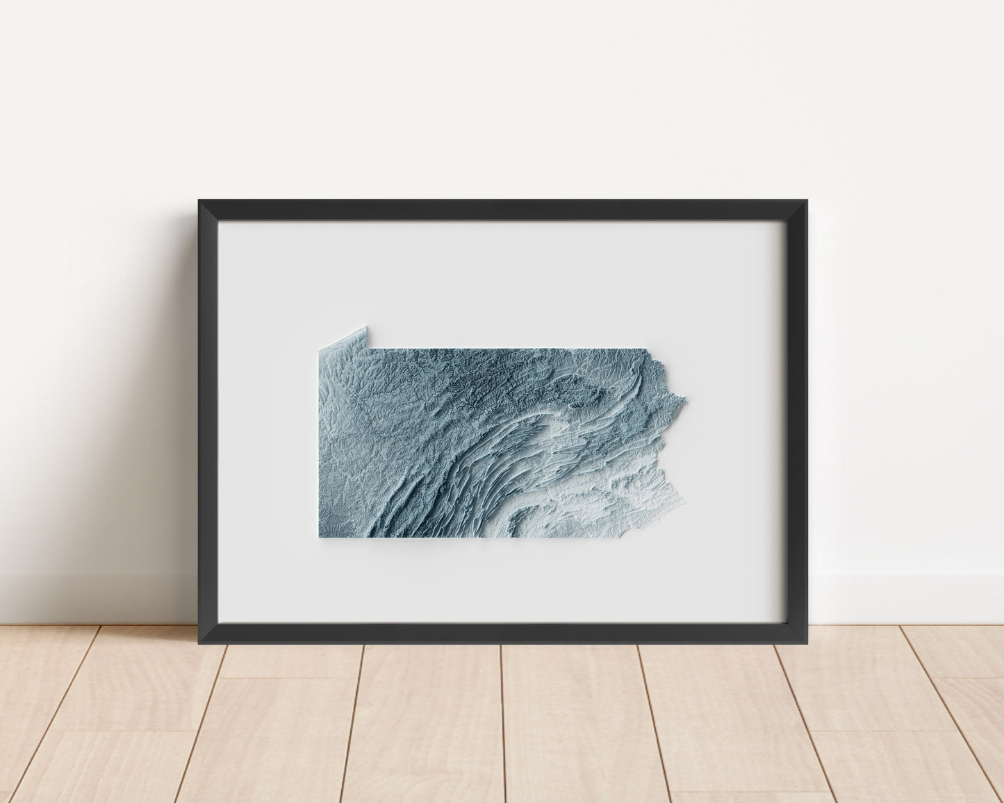 A minimalist relief map of the US State of Pennsylvania in a frame made out of pine wood. Topographic map poster for travel and geography fans.