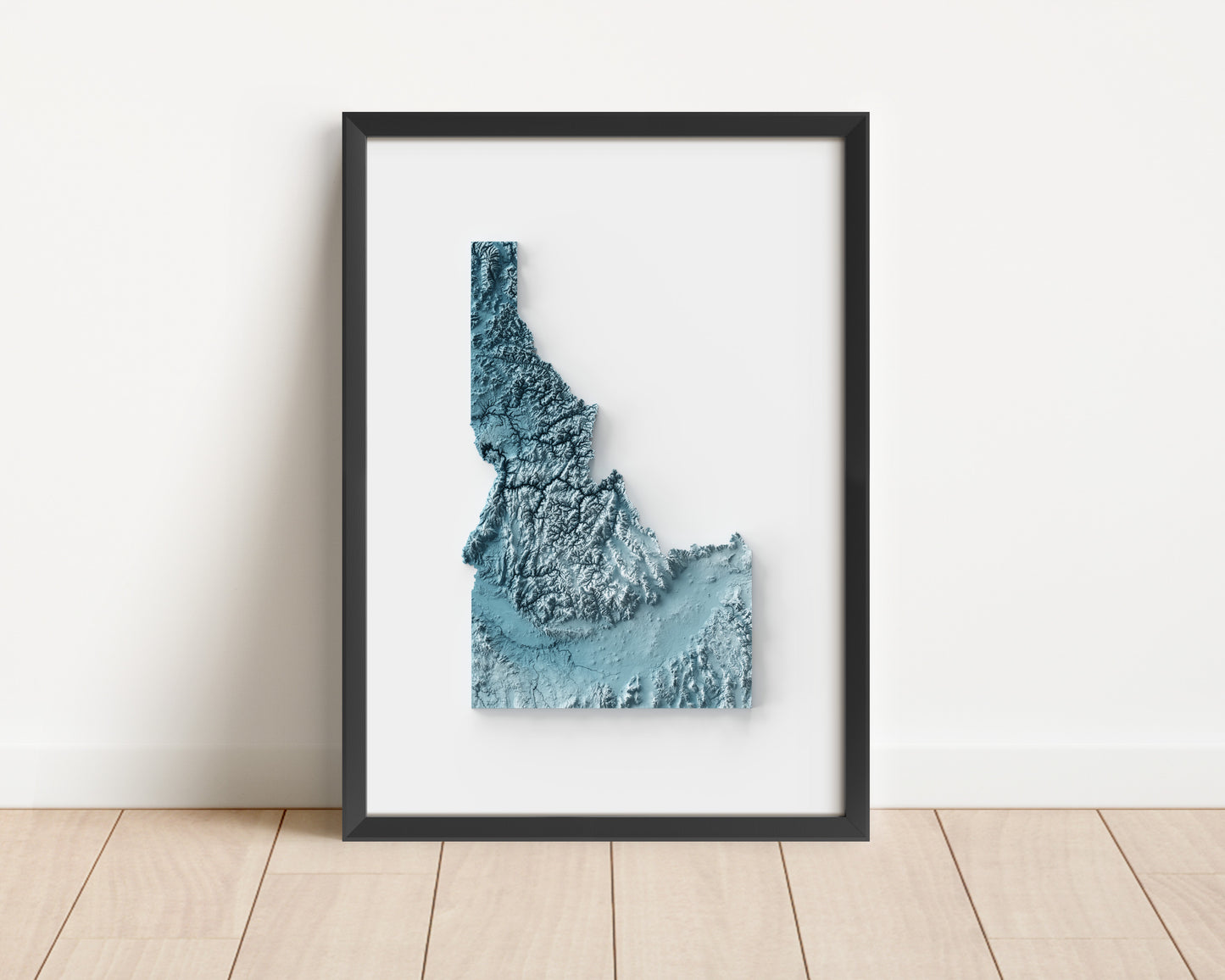 A minimalist relief map of the US State of Idaho in frame made out of pine wood. Topographic map poster for travel and geography fans.