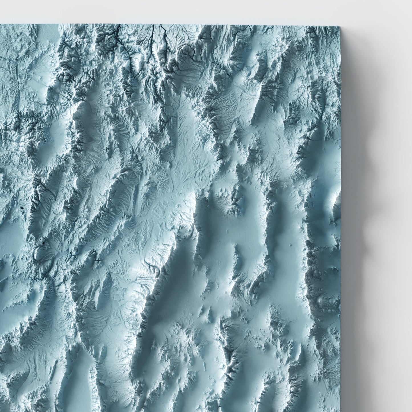 A minimalist relief map of the US State of Nevada in frame made out of pine wood. Topographic map poster for travel and geography fans.