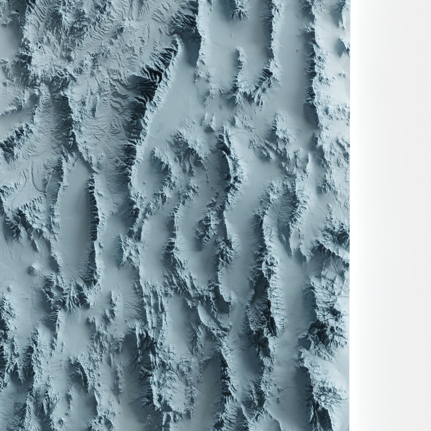 A minimalist relief map of the US State of Nevada in frame made out of pine wood. Topographic map poster for travel and geography fans.