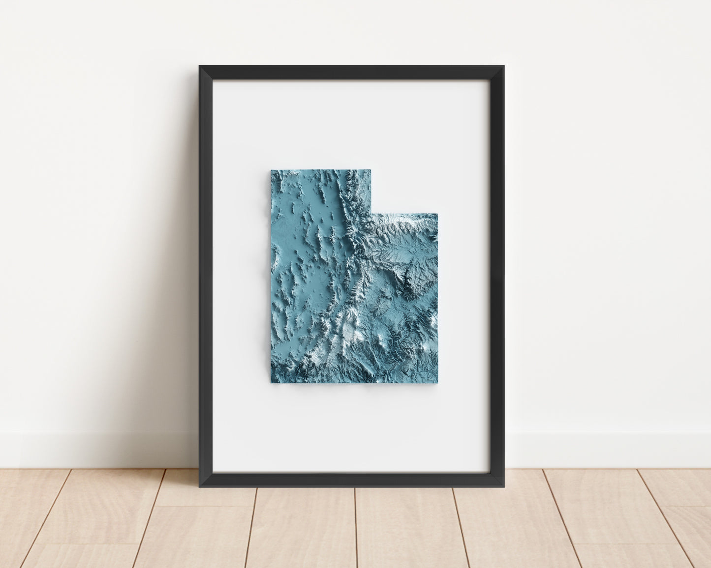 A minimalist relief map of the US State of Utah in frame made out of pine wood. Topographic map poster for travel and geography fans.