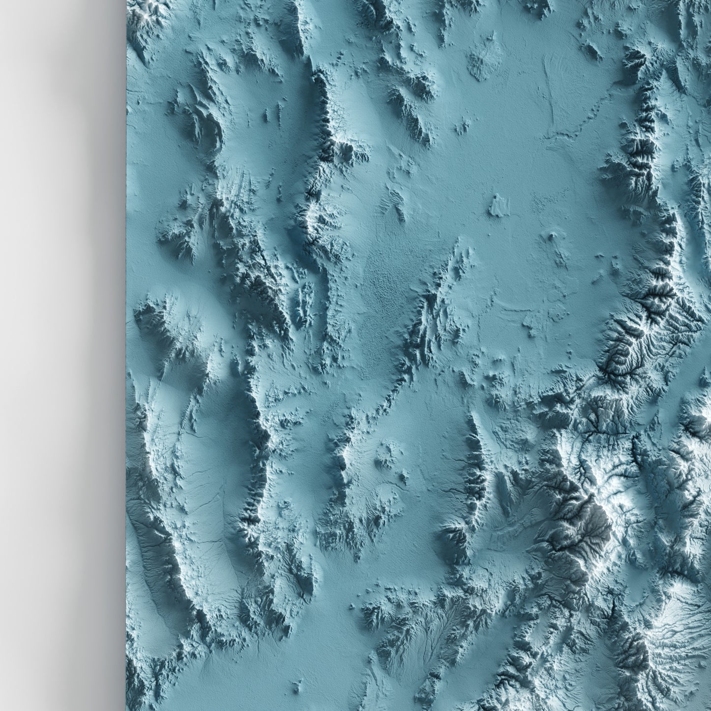 A minimalist relief map of the US State of Utah in frame made out of pine wood. Topographic map poster for travel and geography fans.