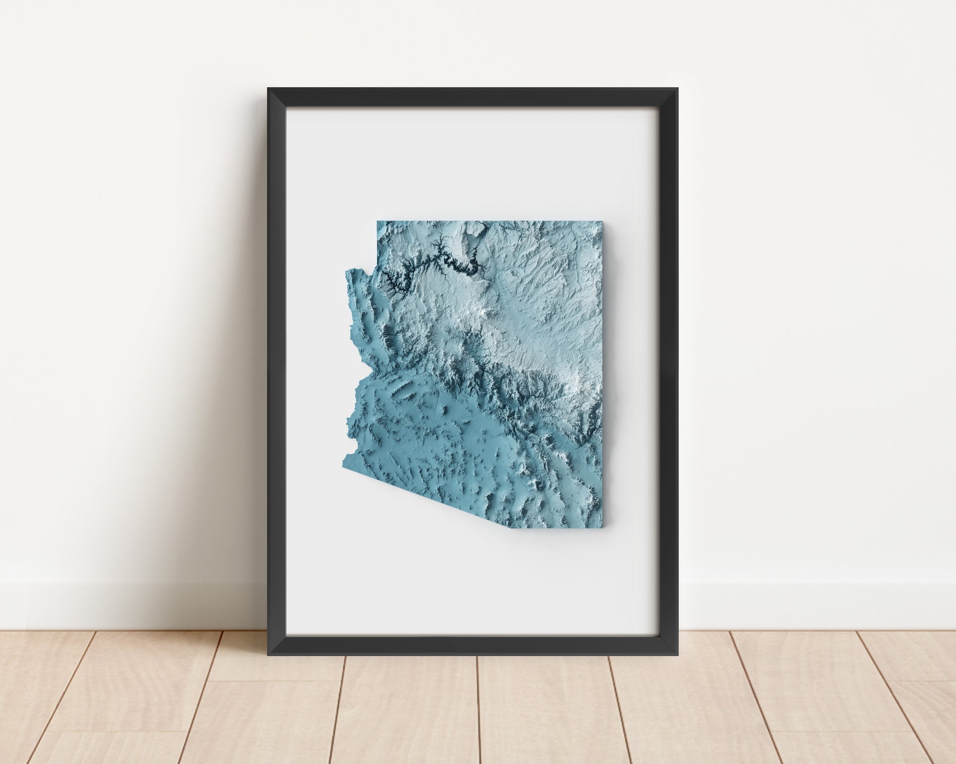 A minimalist relief map of the US State of Arizona in frame made out of pine wood. Topographic map poster for travel and geography fans.