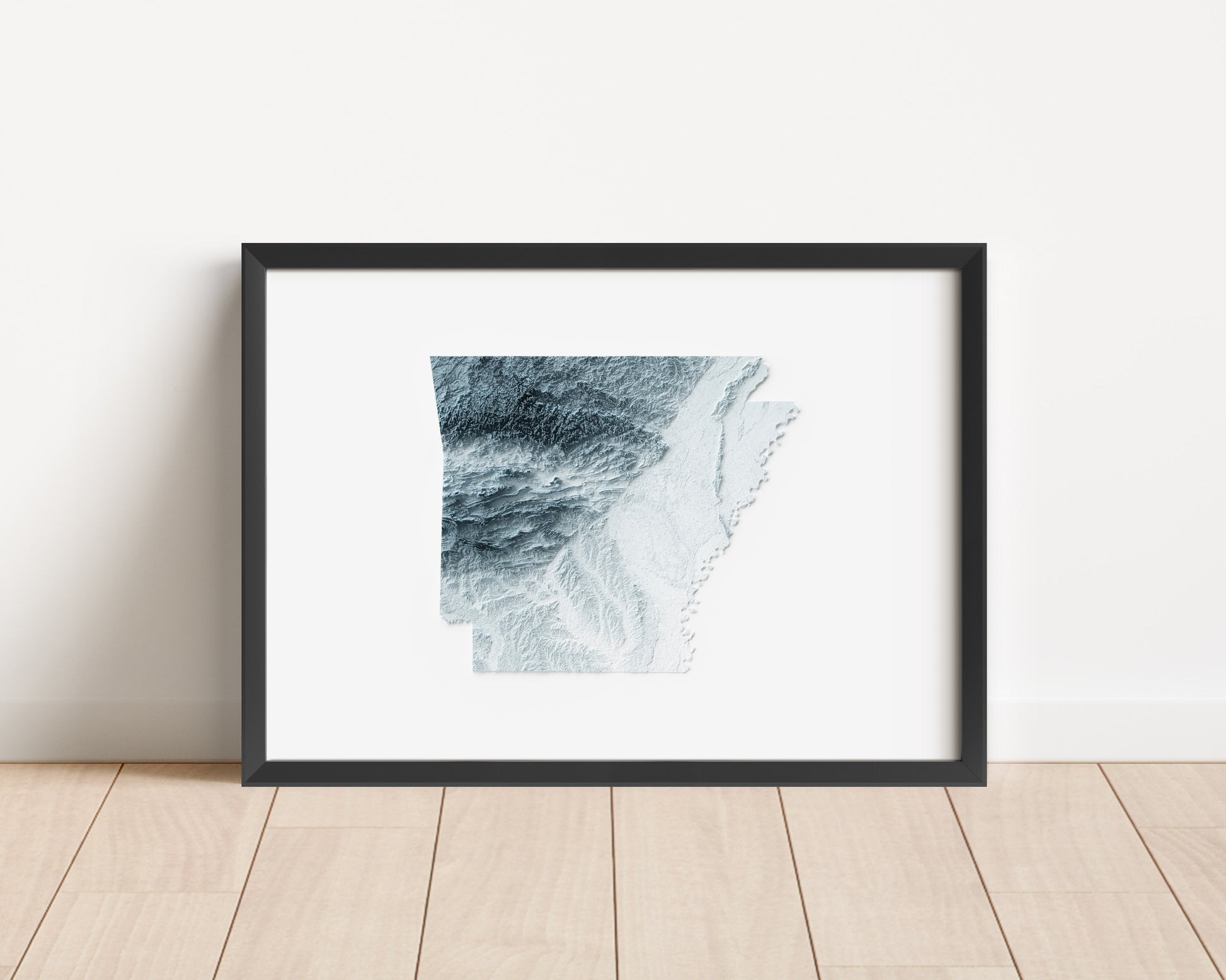 A minimalist relief map of the US State of Arkansas in frame made out of pine wood. Topographic map poster for travel and geography fans.