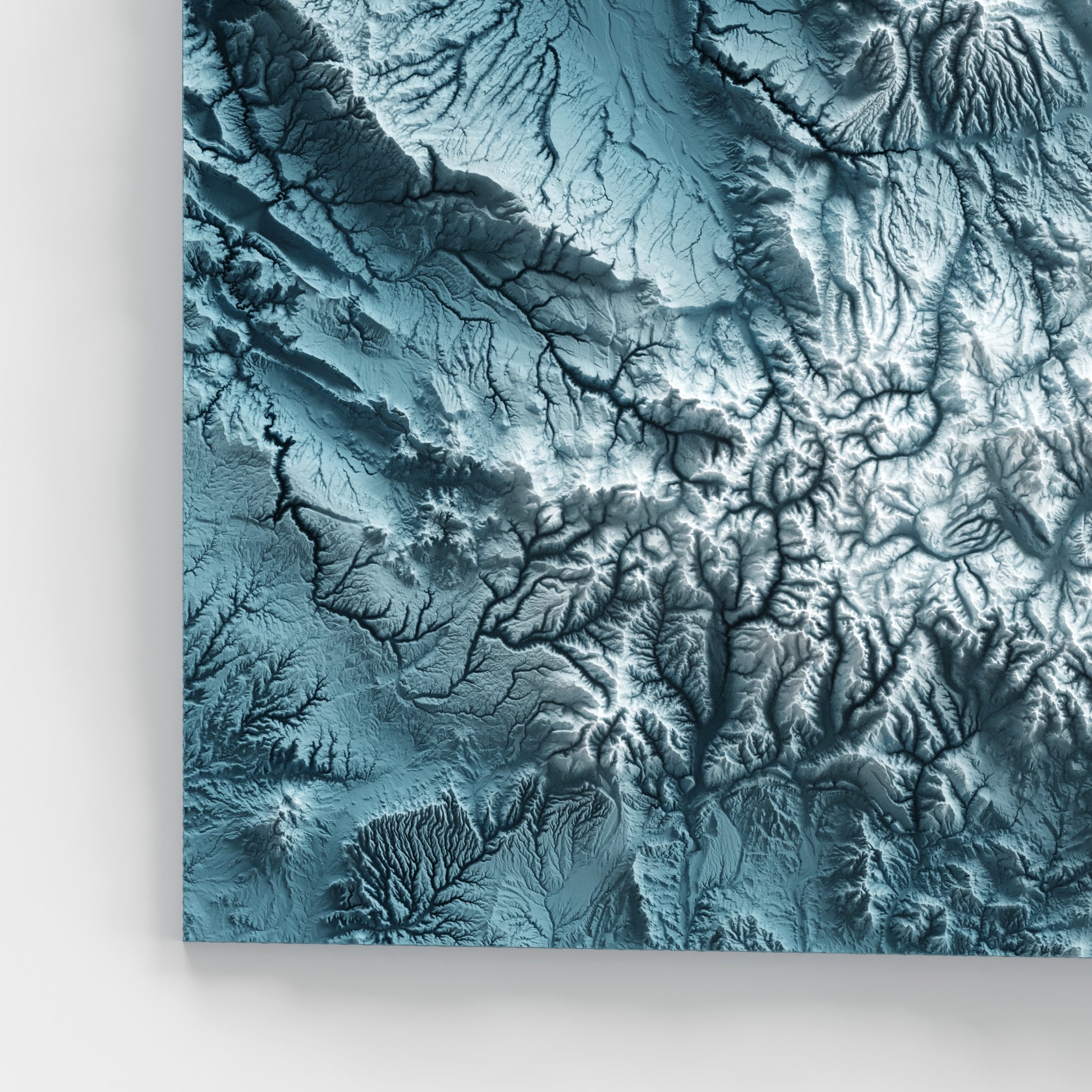 A minimalist relief map of the US State of Colorado in frame made out of pine wood. Topographic map poster for travel and geography fans.
