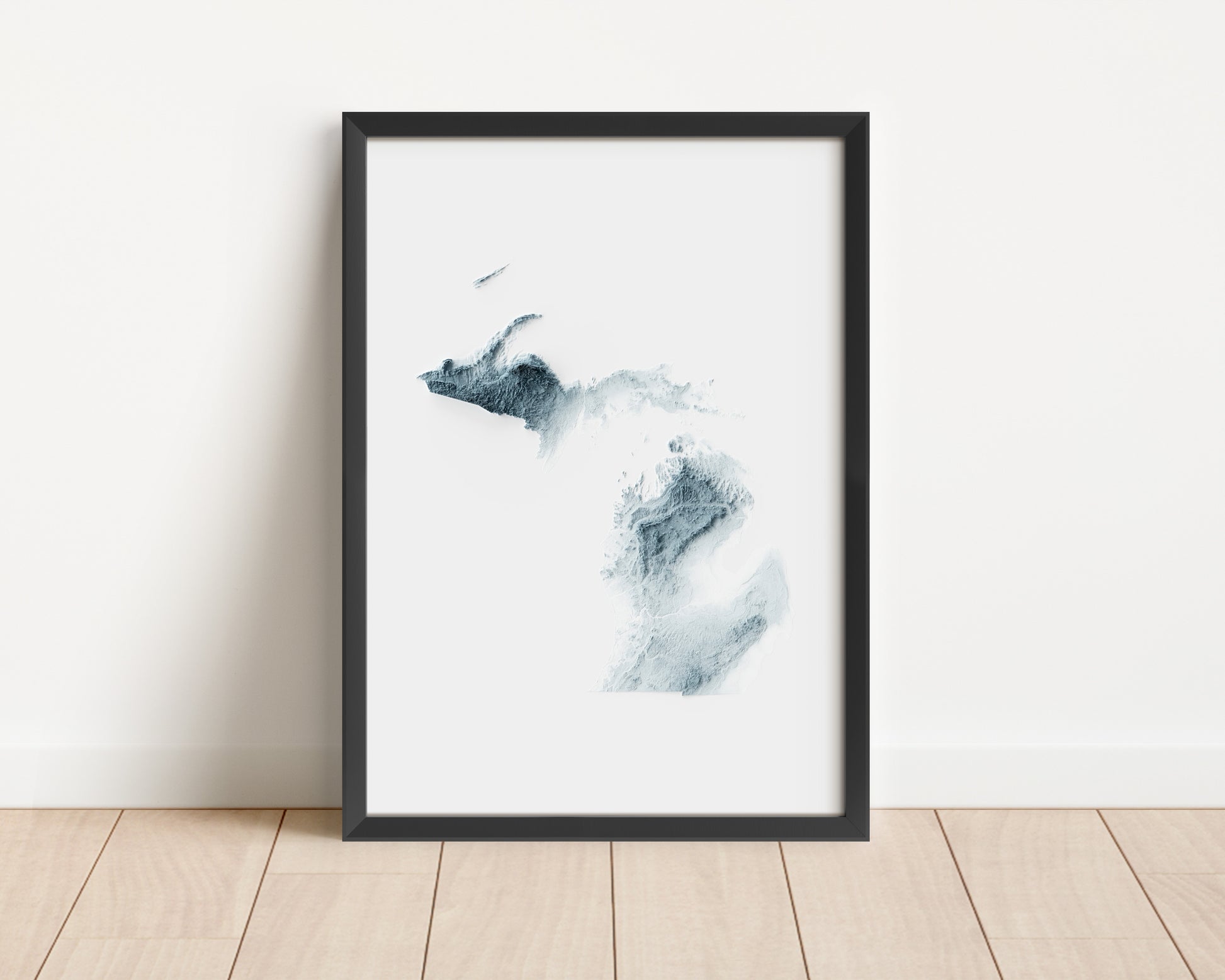 A minimalist relief map of the US State of Michigan in a frame made out of pine wood. Topographic map poster for travel and geography fans.