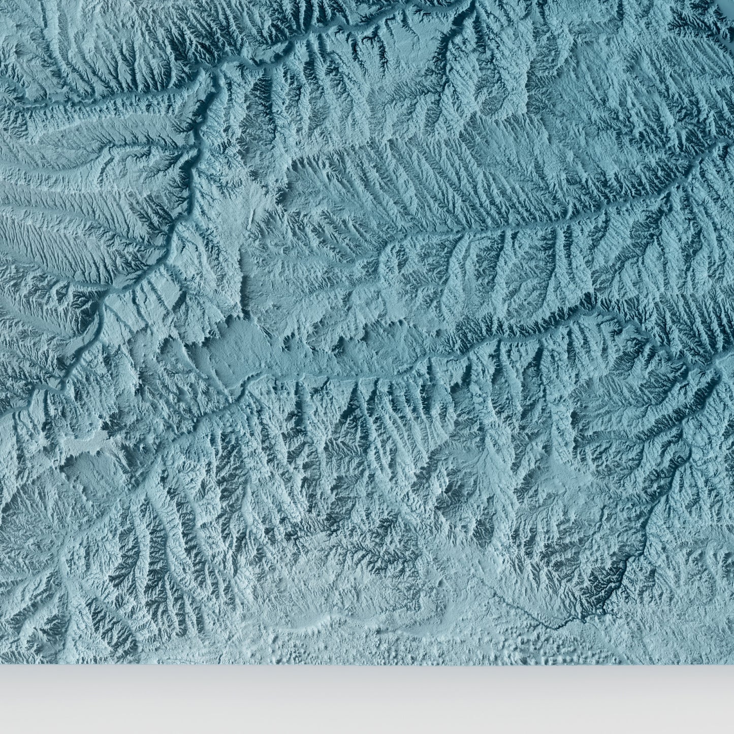 A minimalist relief map of the US State of South Dakota in a frame made out of pine wood. Topographic map poster for travel and geography fans.