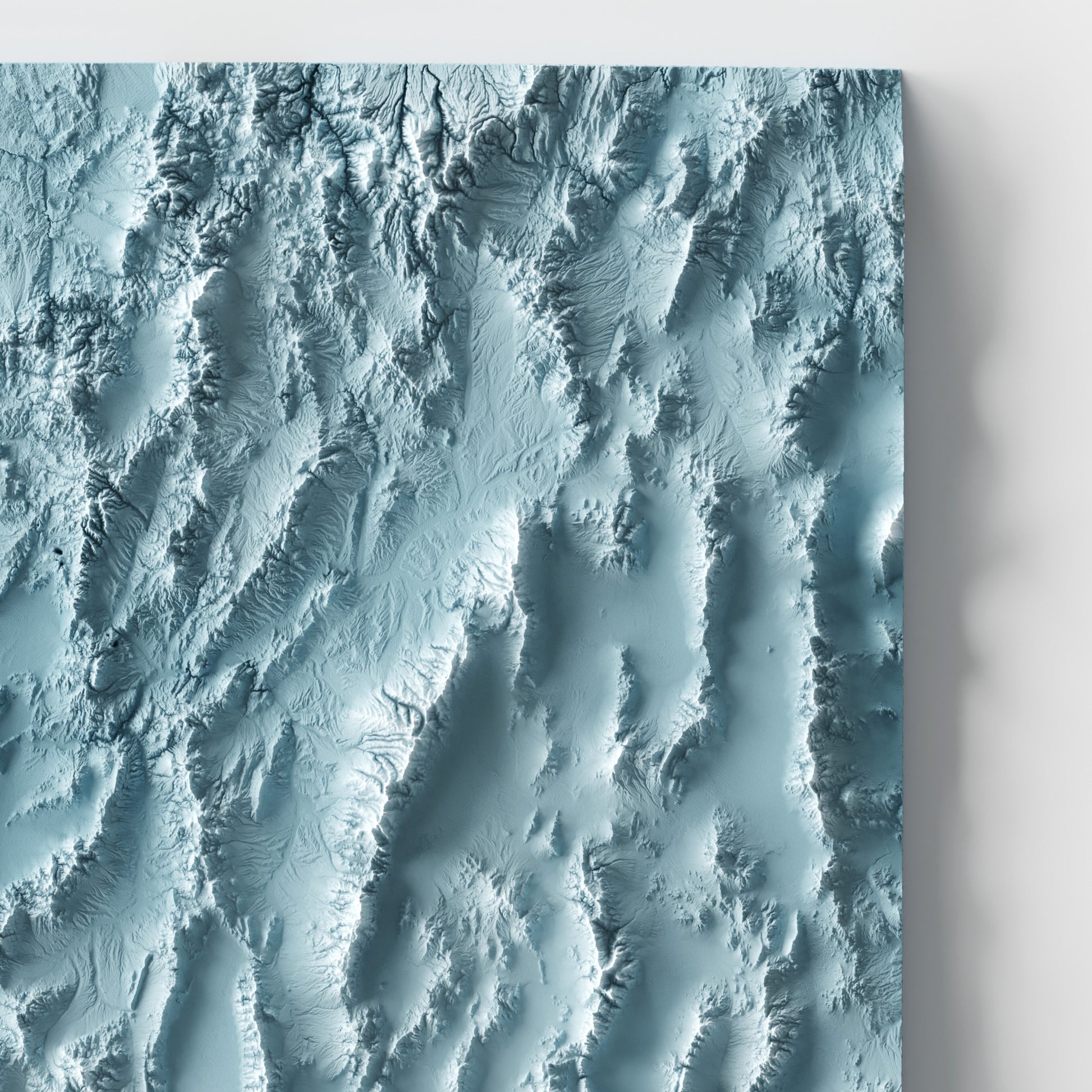 A minimalist relief map of the US State of Nevada in frame made out of pine wood. Topographic map poster for travel and geography fans.