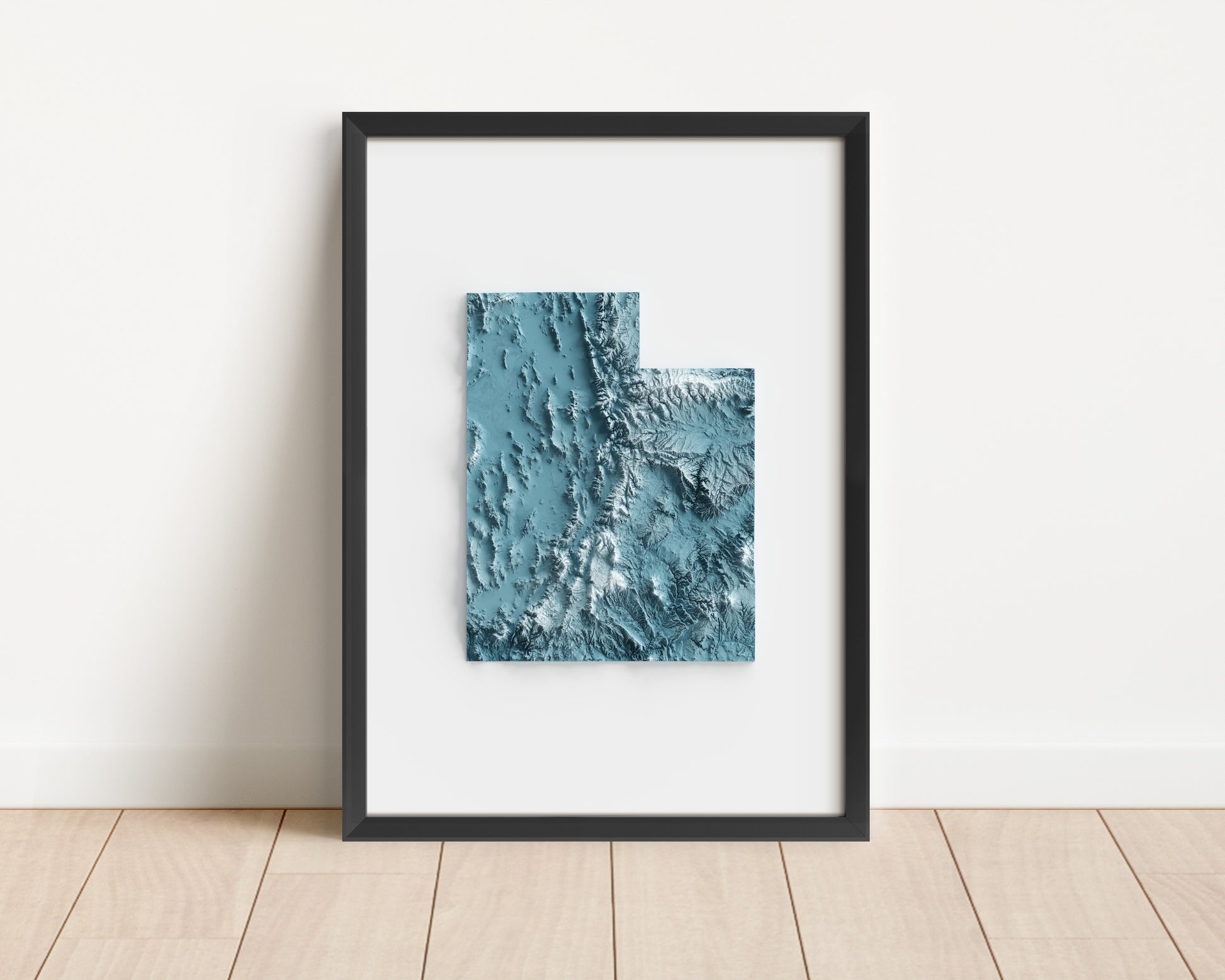 A minimalist relief map of the US State of Utah in frame made out of pine wood. Topographic map poster for travel and geography fans.