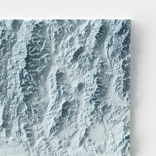 A minimalist relief map of the US State of Washington in frame made out of pine wood. Topographic map poster for travel and geography fans.